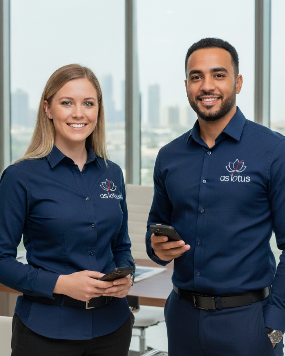 Two As Lotus representatives ready to assist clients with home services inquiries in Dubai